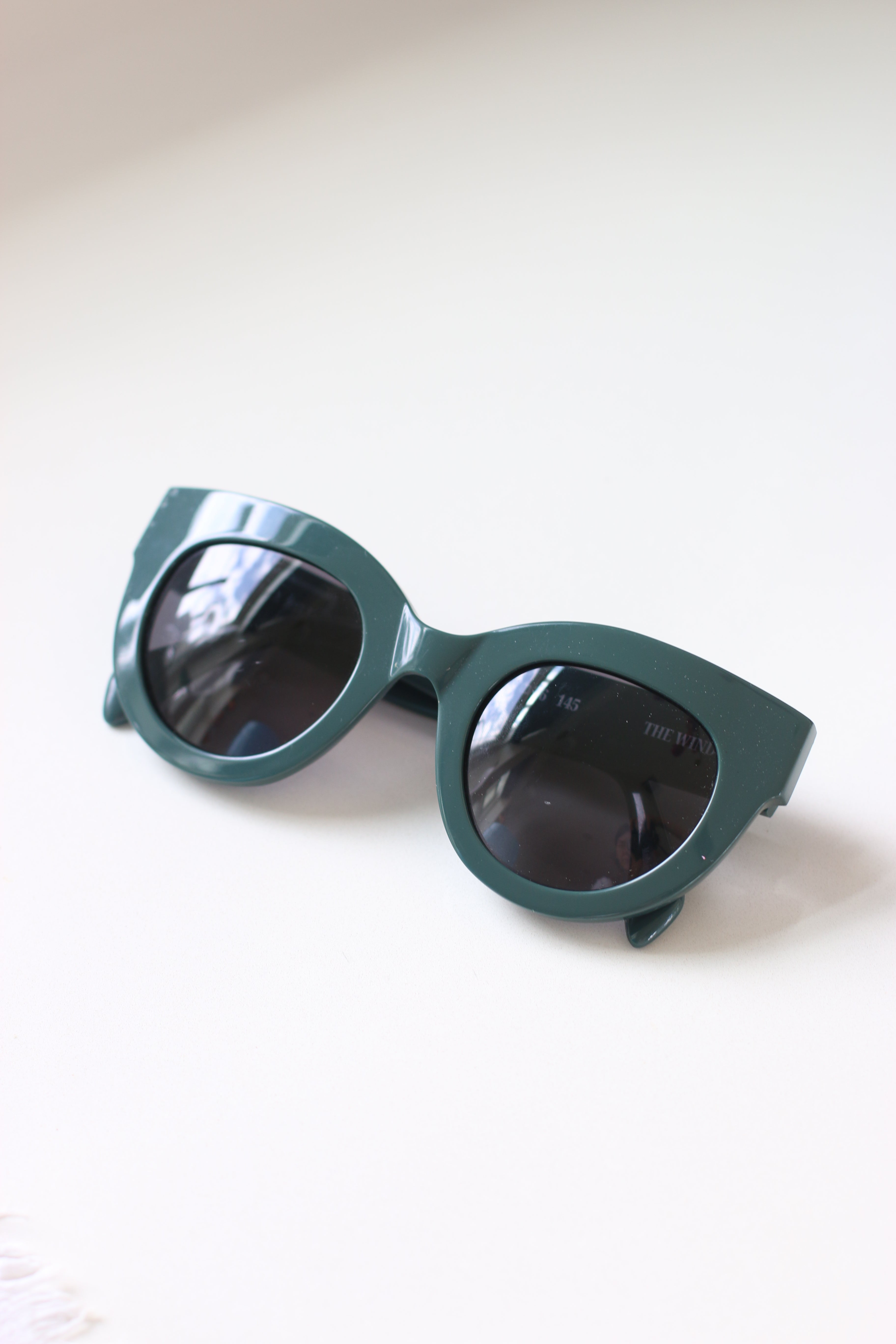 ANEA HILL The Wind: Luxury green sunglasses return with polarized lenses for exceptional clarity.